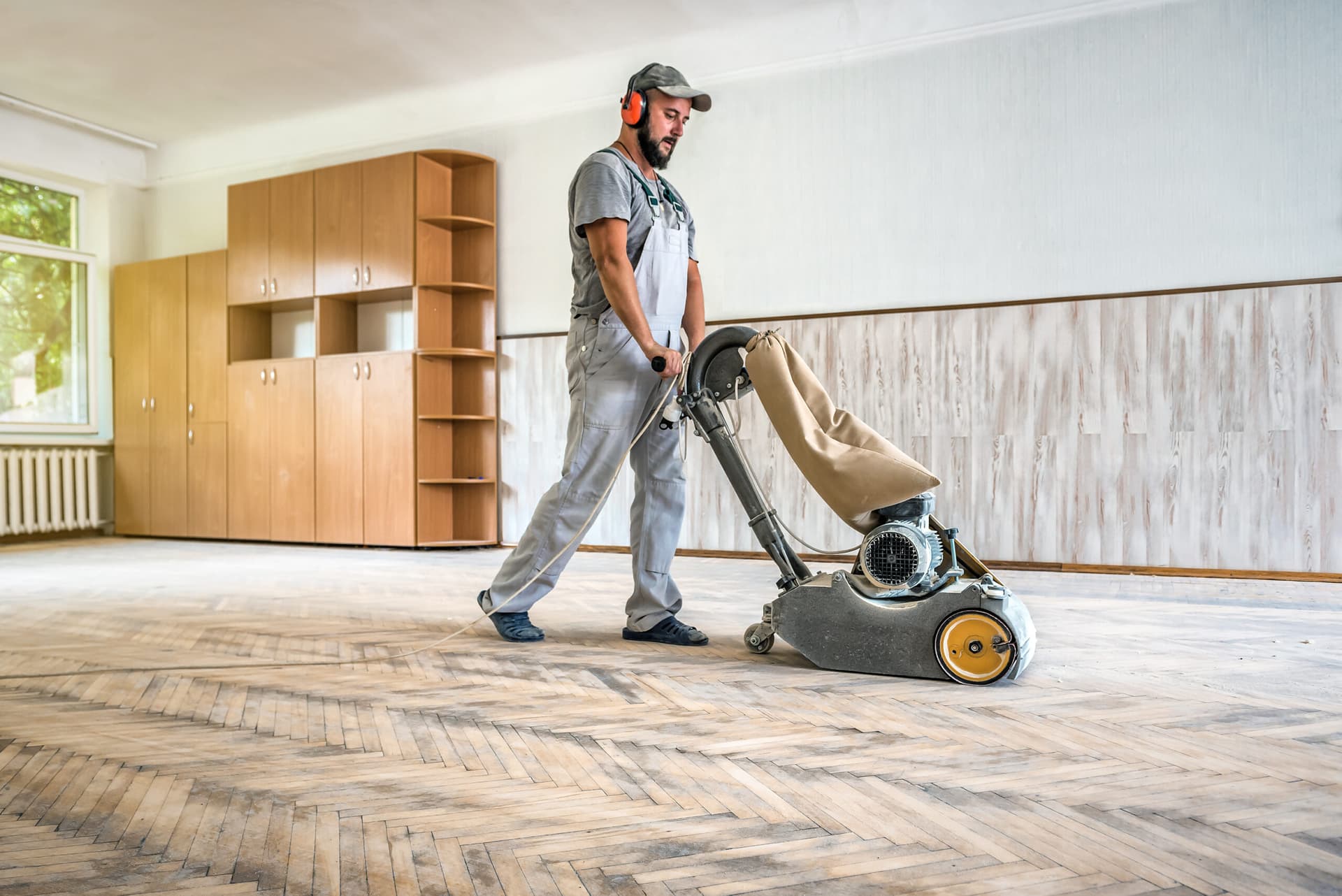 Craftsman working on hardwood floor